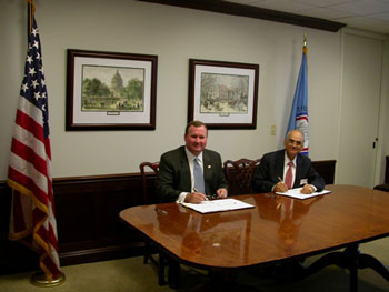 CFTC Chairman James E. Newsome and SEBI Chairman G.N. Bajpai Sign CFTC-SEBI Cooperation Arrangement During a Ceremony at the CFTC's Washington, D.C., Headquarters on April 28, 2004