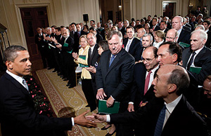 Photo showing U.S. President Barack Obama, left, shaking hands with Gary Gensler, chairman of the Commodity Futures Trading Commission, after making remarks on financial regulatory reform in the East Room of the White House.