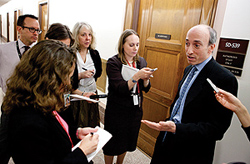 Photo showing Gary Gensler, chairman of the Commodity Futures Trading Commission (CFTC), speaking to a reporter following a Senate Banking Committee hearing on the causes and lessons of the May 6 stock market plunge in Washington, D.C., U.S., on Thursday, May 20, 2010.
