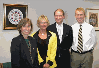 Photograph of SEC Commissioner Paul Atkins Visiting with CFTC Commissioners Sharon Brown-Hruska, Barbara Holum, and Walt Lukken