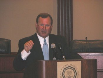 CFTC Chairman Newsome at the Podium Addressing Members of the Media, August 26, 2003.