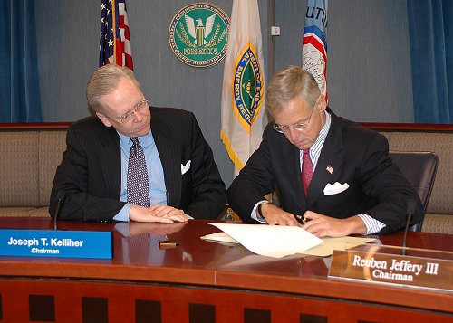 CFTC Chairman Jeffery III (right) signing the CFTC-FERC Memorandum of Understanding with FERC Chairman Kelliher.