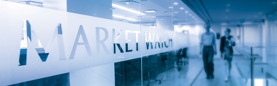 Photo Showing Division of Market Oversight staff outside the Market Watch room. Photo by Clark Day Photography.