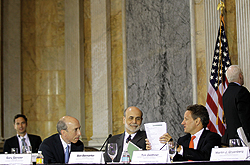 Photo showing Chairman of the U.S. Commodity Futures Trading Commission Gary Gensler, Chairman of Federal Reserve Board Ben Bernanke, and U.S. Secretary of the Treasury Timothy Geithner chatting at the end of the open session of the Financial Stability Oversight Council (FSOC) meeting July 18, 2011 at the Treasury Department in Washington, DC. Photo by Alex Wong/Getty Images.
