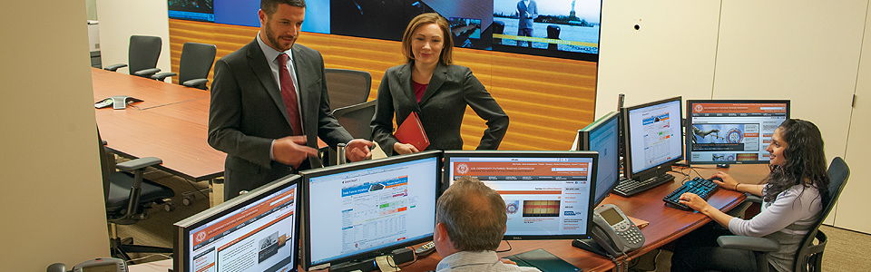 Photo showing Division of Market Oversight and Office of General Counsel staff in the Market Watch room. Photo by Clark Day Photography.